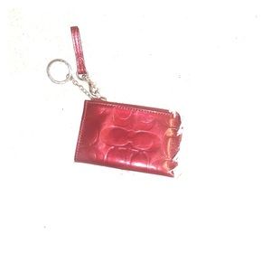 Coach burgundy patent leather wristlet/ keychain.